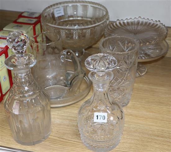A collection of cut and moulded glassware including decanters, fruit bowls, etc.